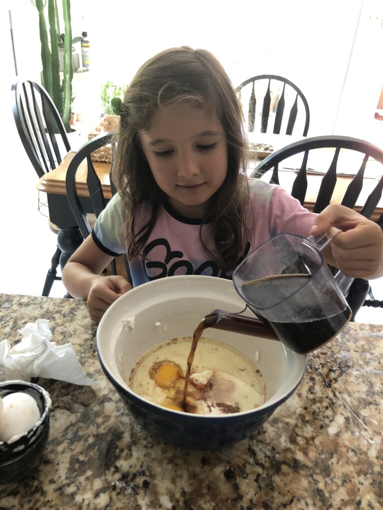 My granddaughter helping to make the Best Ever Chocolate Cake.