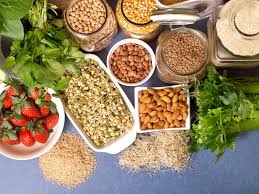 Soluble fiber such as found in some fruits, vegetables, oats, and barley lowers cholesterol by decreasing its absorption and increasing its secretion. 